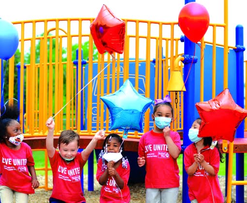 kids holding balloons