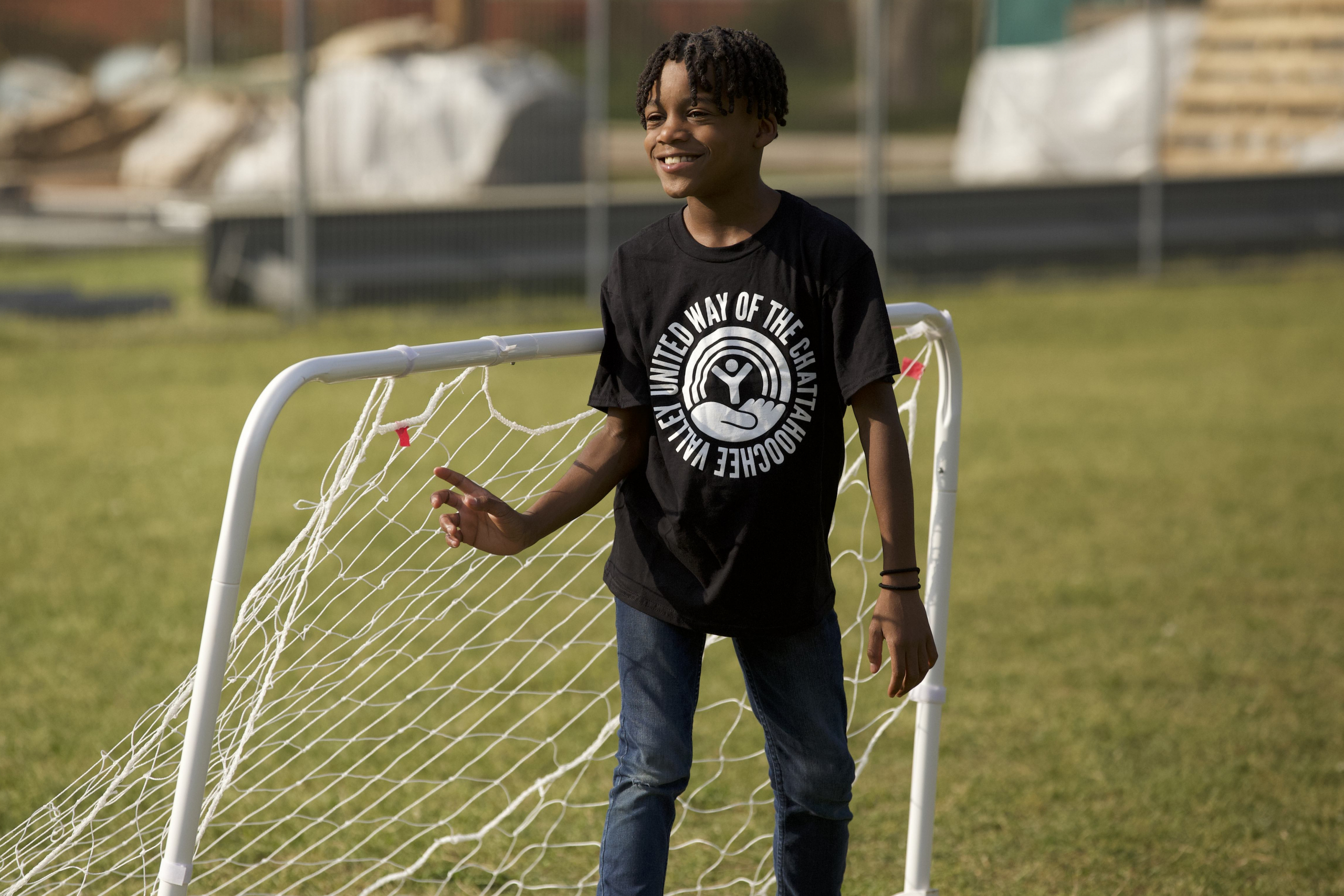 child at soccer nete