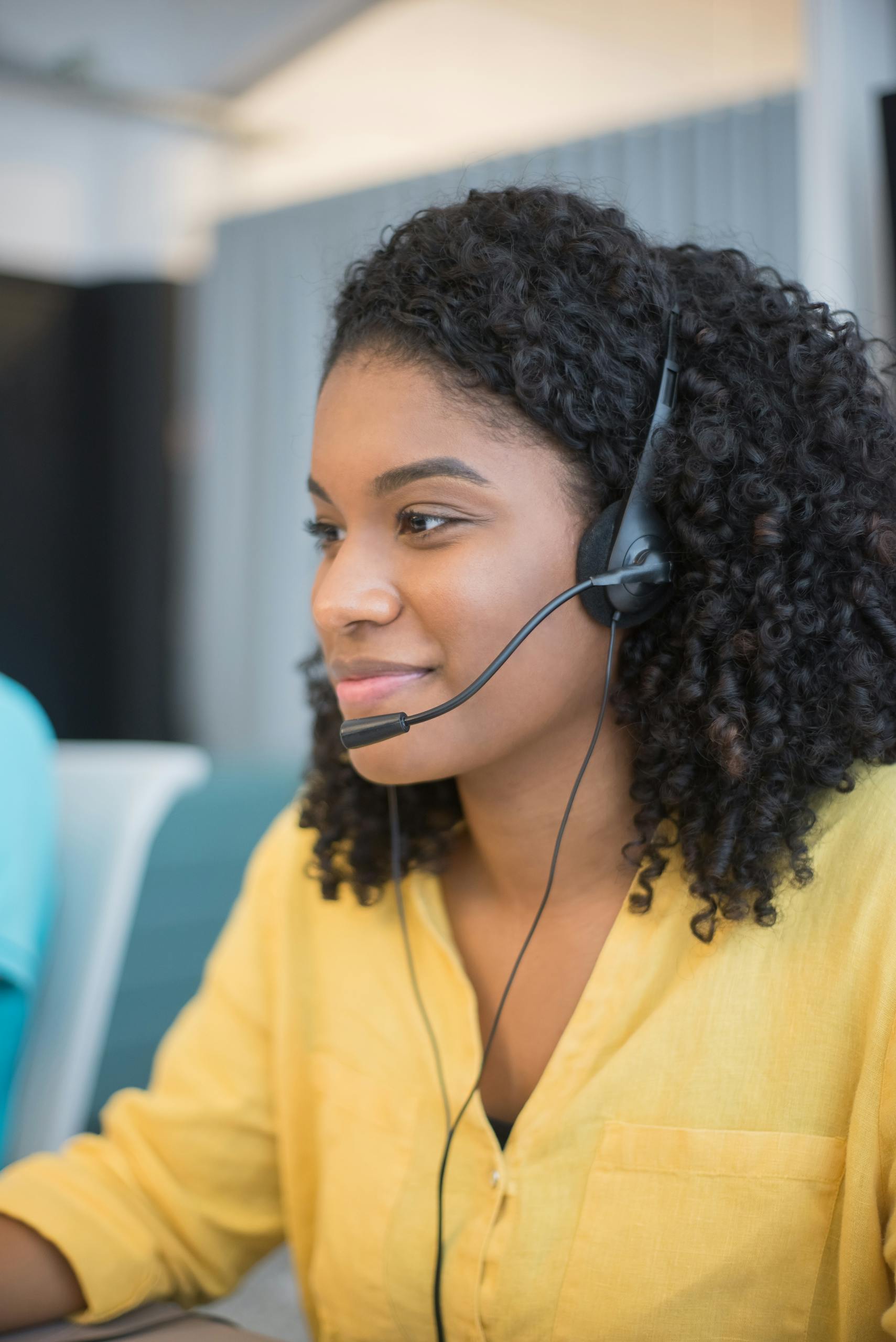 A Call Center Agent Wearing Headphones