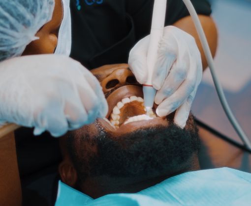 Close-up of a dentist performing a dental procedure on a patient in Lagos clinic.